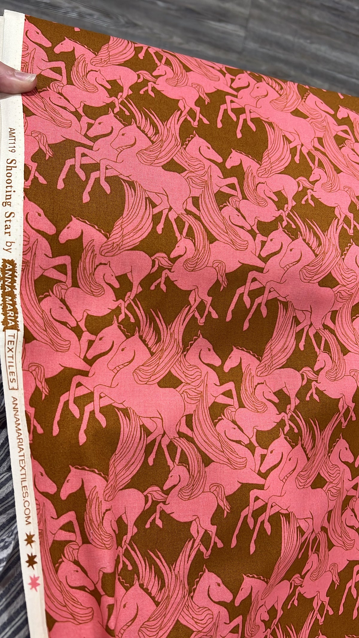 Shooting Star Mythology Pegasus fabric by Anna Maria, folded to show the horse print texture in a soft taffy colorway