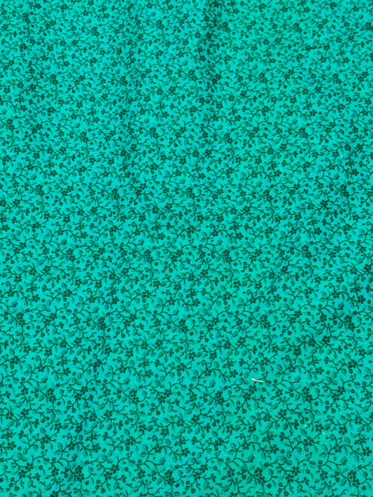 FLOWER ON bluish green fabric on vine