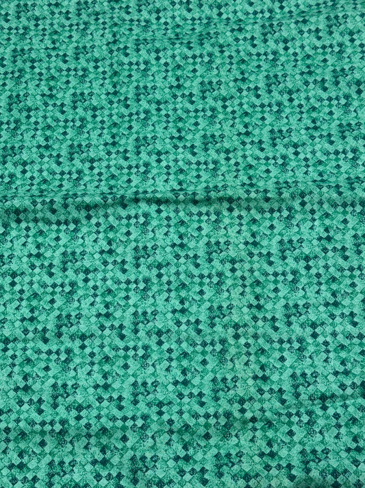 Greenish blue fabric with black and greenish squares
