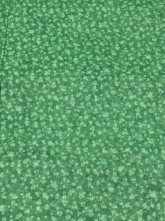 FABRIC TRADITIONS greenish fabric with leaves on a vine